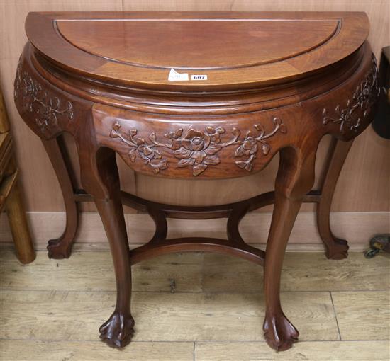 A Chinese padouk demi-lune table, W.95cm